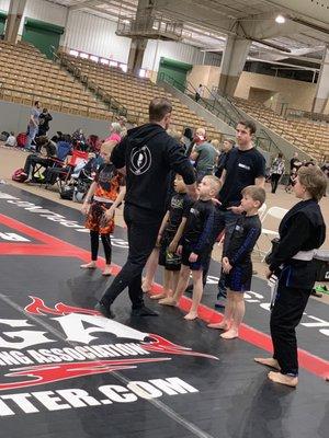 Professor Sean coaching the team at Naga.