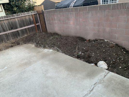 Before:  Excess soil that was removed from an area of the yard.