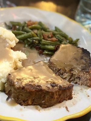 Meat Loaf  $15.99 topped with brown gravy with garlic mashed potato and seasonal vegetable