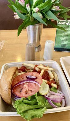 Central market burger w/ french fries and all the fixings.