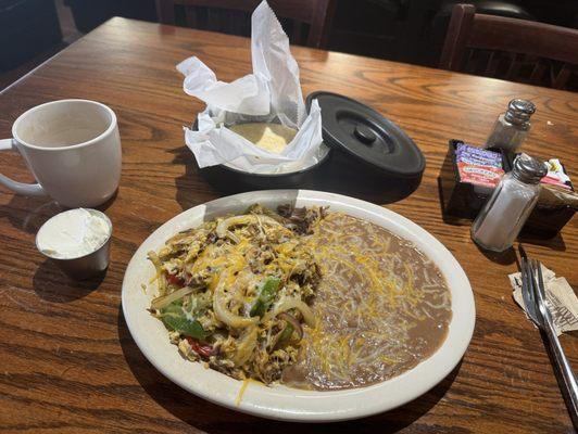 Machaca con Huevos, coffee, side of sour cream.