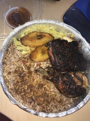 Medium jerk chicken with rice and beans, splash of gravy, cabbage and plantains. Hot sauce on the side