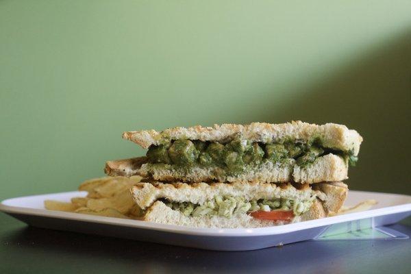 Try our Chicken Pesto Panini or our Tofu Pesto Panini (vegan), both have housemate pesto with tomatoes and balsamic glaze.