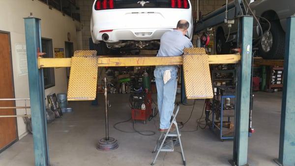 Larry installing my new MagnaFlow mufflers.