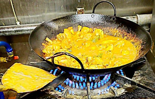 Chicken Karahi cooking fresh on the stove in the kitchen.