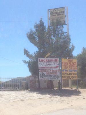 The front of the building where the shop is located. Continue straight on the dirt road and make a left at the gate to enter.