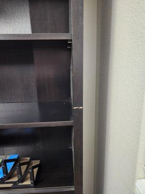 scuffed bookshelf.