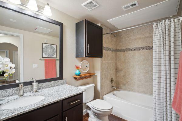 Guest bathroom with granite counter tops and garden tub