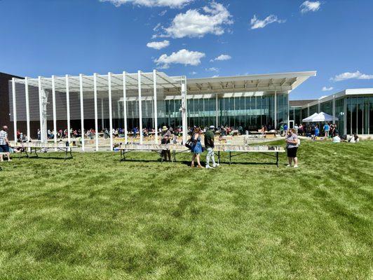 Outside looking at the  August book sale - 2hrs into sale. Long lines still