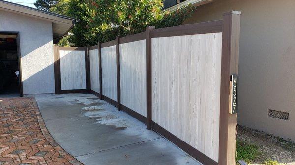 Exclusive color mix vinyl privacy fence.
Designed manufactured and installed by Torrance Fence Company.