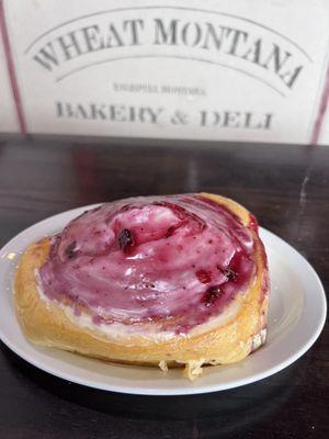 Huckleberry cream cheese cinnamon roll