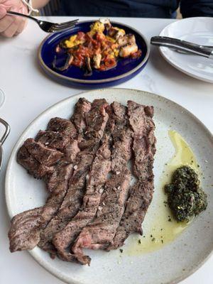 10oz skirt steak with small dip of chimichurri