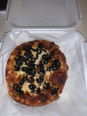 Personal pan pizza with black olives.