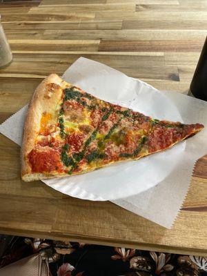 Margarita pizza slice sop up