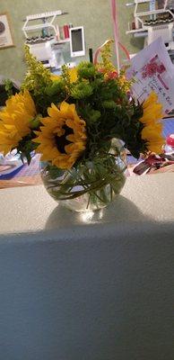 This is supposed to be a Deluxe arrangement.  It's barely 8" tal with 6 wilted sunflowers