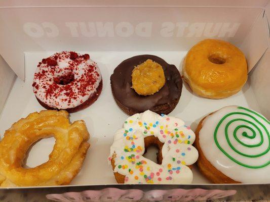 Top row - red velvet, German chocolate, regular glazed Bottom row - old fashioned, Birthday cake, key lime