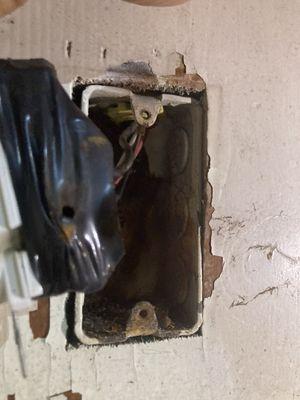 This plug was arcing against the metal box causing a breaker to trip constantly in the basement.