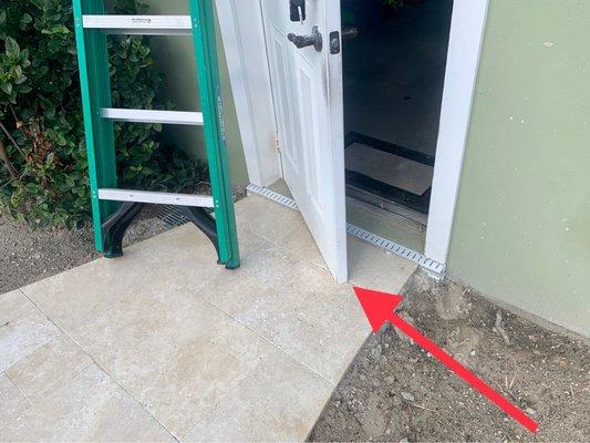 Garage door obstructed by Bowles' walkway. That's as far as our garage door would swing open.