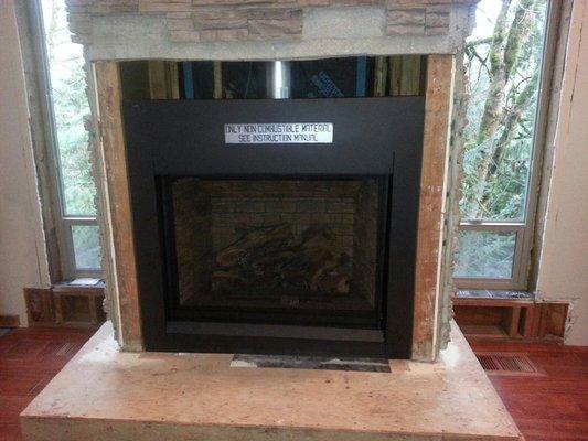 New gas (propane) fireplace from Regency. Nice large opening with remote.