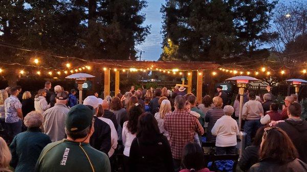 Outdoor Good Friday service in the Ainsley House Gardens.