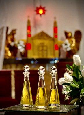 Little Flower has the oils to do anointing of the sick, confirmations, ordinations. Pretty tabernacle in the background.