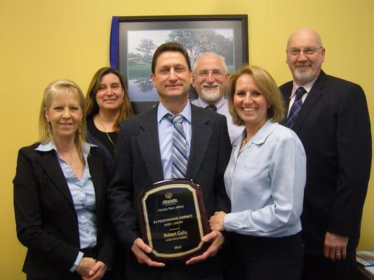 Meet our staff! Here we are shown receiving our 2013 Agency Achievement award.