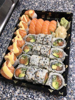 Golden roll on left, salmon nigiri, and 2 Alaska rolls. Take out this time.