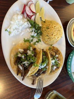 Carne asada and carnitas tacos with lots of onions and cilantro!