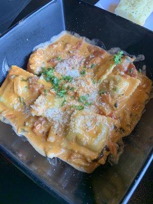 Mushroom ravioli with pink sauce