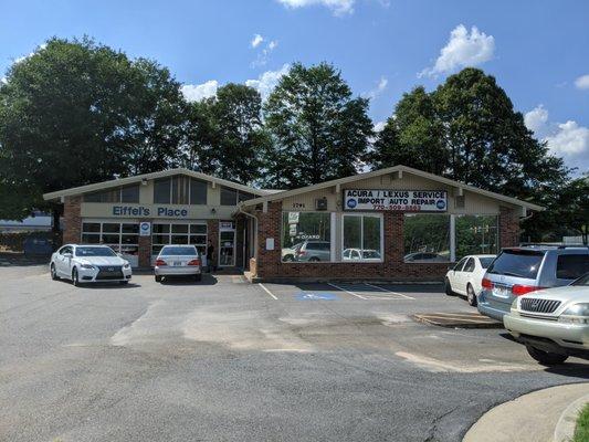 Outside. Storefront. They have four bays and three lifts.