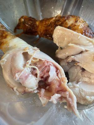 Undercooked drumstick from a rotisserie chicken