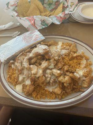 Chicken and Rice. Highly recommend getting this item. The queso isn't bad either. 10/10 5 Stars