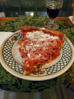 Spinach, sausage and green olive stuffed pizza