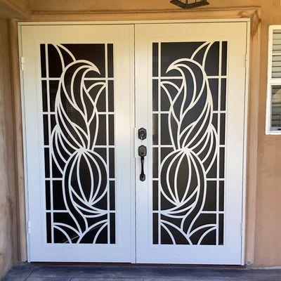 Professional security screen door installation for French set front doors in Austin. Titan style pictured.