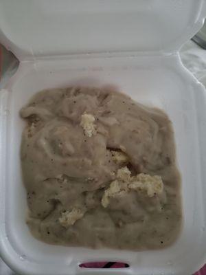 Half order of Biscuits and Gravy, half eaten. Sooooo much gravy!