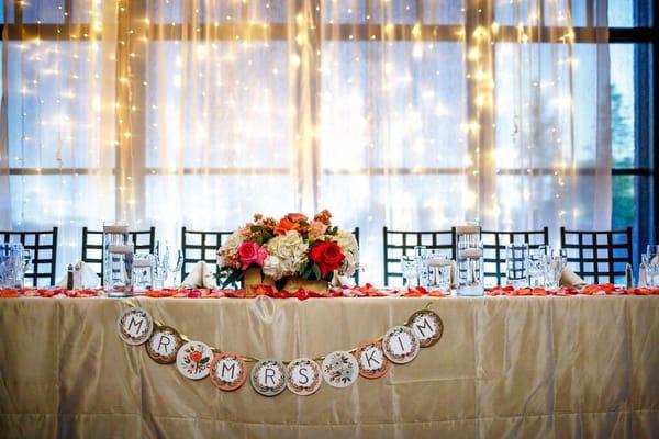 the flower petals and centerpiece made our head table extra gorgeous!