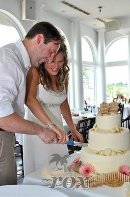 Wedding Cake cutting at Fager's island in Ocean City, MD