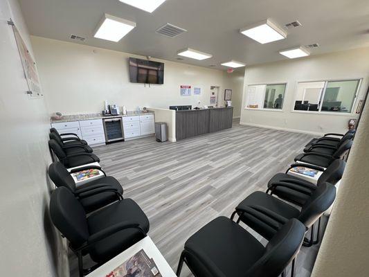 Different view of lobby area showing coffee bar of Winners Circle Collision auto body shop