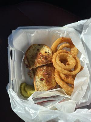 Reuben sandwich and onion rings