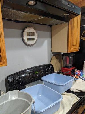 Containers to capture the rainwater leaking through the roof (via attic).