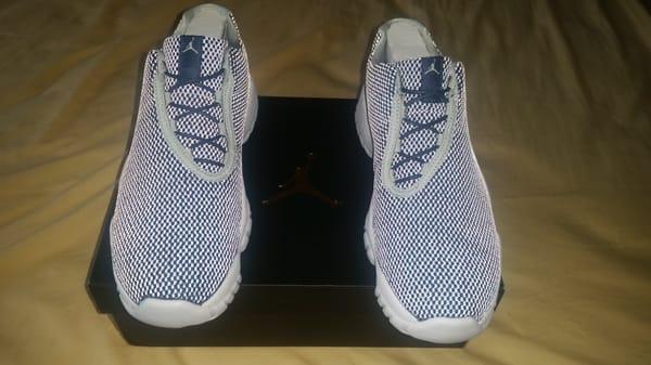 Using the flash to show off the bling of the navy pair of Jordan AJ Low Future.