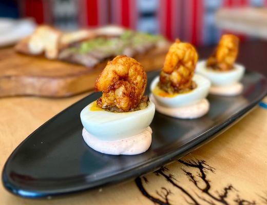 Tunisian Deviled Eggs w/ machwiya mix, topped w/ roasted shrimp | $15