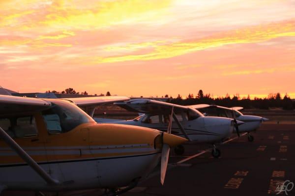 A few of our airplanes, with one of those famous Central Oregon sunsets in the background.