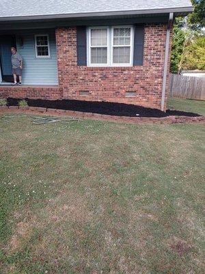 River rock and black mulch job.