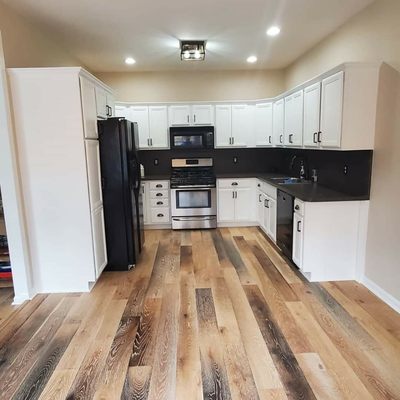 Job finished painting the cabinets brown to white.