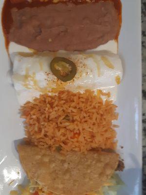 Beef and chicken enchiladas, beans and rice.