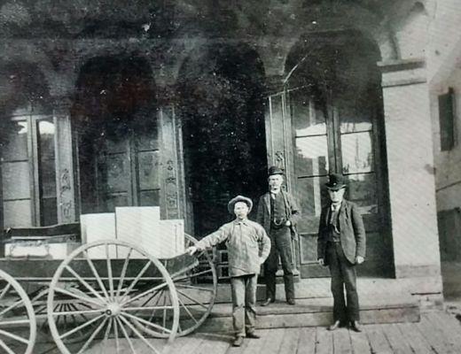 Historic Photo in front of Storefront (1890's)