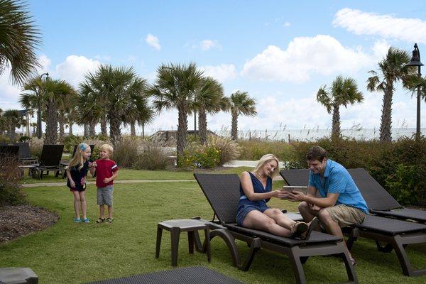 Family in outdoor lounge area