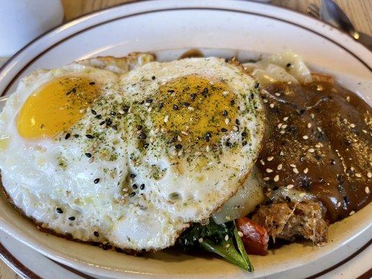 THE ISLAND Kalua pork, Portuguese sausage, furikake (sesame and seaweed seasoning), green onions, pepper jack cheese & brown gravy.