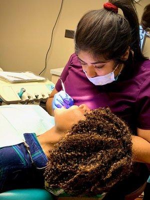 Dental assistant Ana performs orthodontic treatment for a fast braces patient.